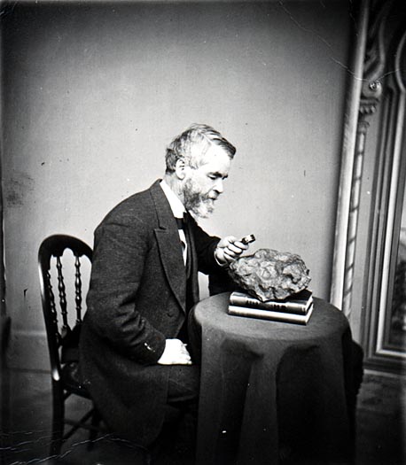 Increase Lapham examines a meterorite that had fallen in Wisconsin, circa 1868.