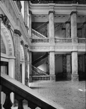 Photograph featuring a staircase and columns inside the Milwaukee Public Library, now the Central Branch, circa 1933. 