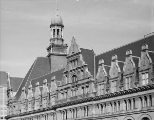 An unusual view of the ornamentation on the roof of City Hall.