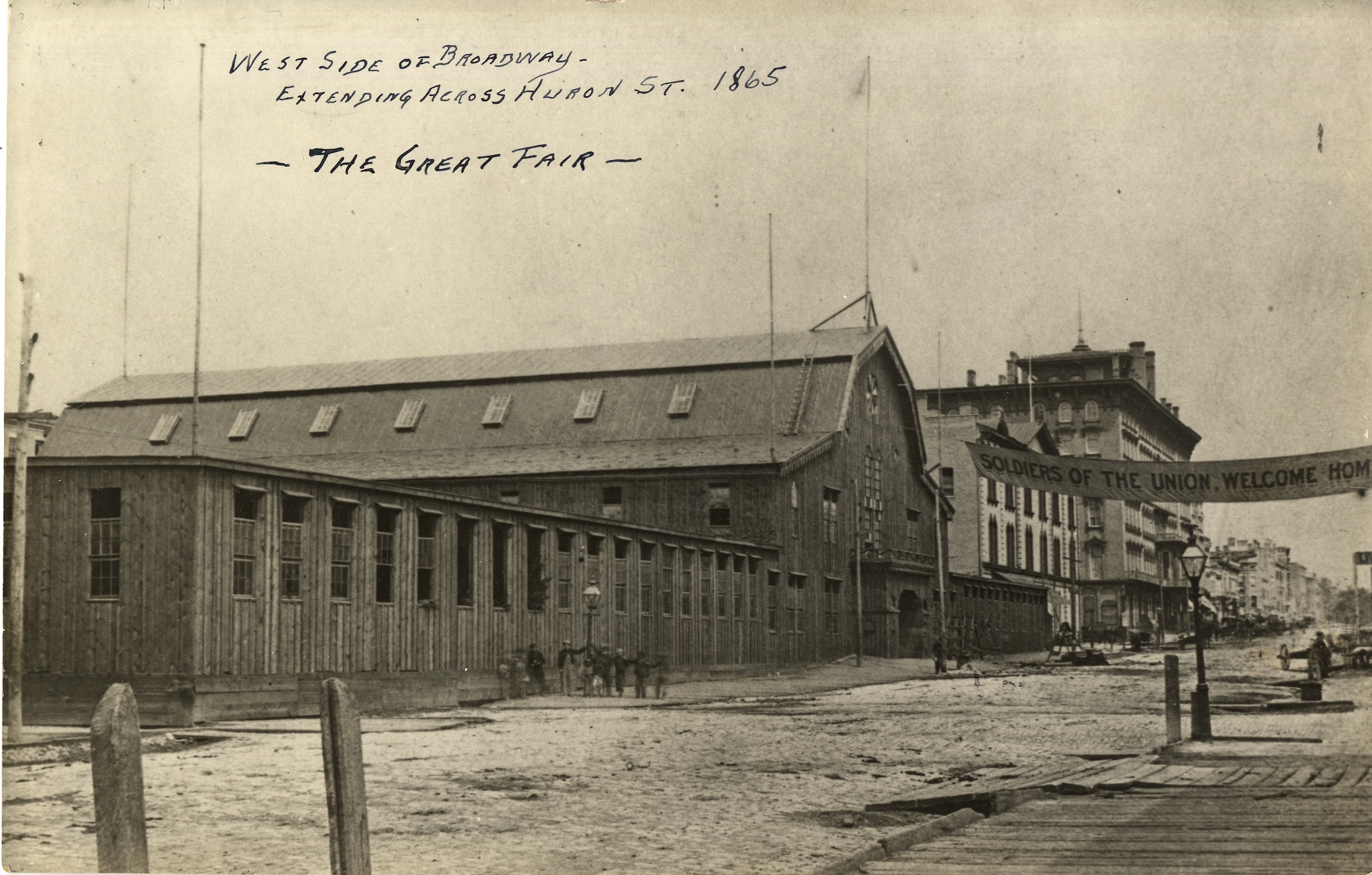 Photograph of the wooden building constructed for the Wisconsin Soldiers' Aid Fair held in 1865.