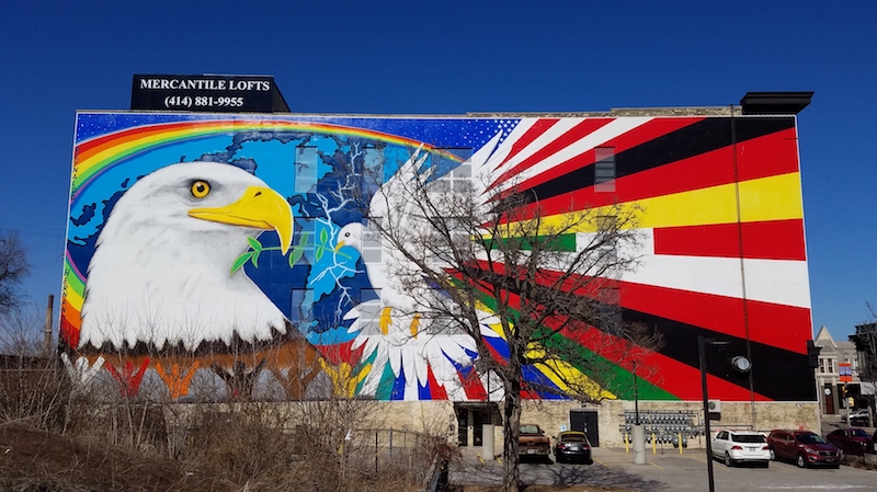 Photograph of Esperanza Unida, or "Mural of Peace," painted by Reynaldo Hernandez on the side of a building on W. National Avenue in the Walker's Point neighborhood. 