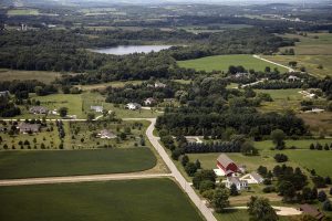 This 2016 photograph of the Town of Erin shows the combination of rural farms and modern housing that characterize its twenty-first century development.