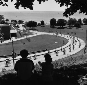 Bicycle racers head down the hill below the Northpoint Water Tower in 1982.