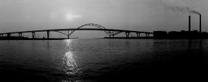 The rising sun illuminates the Hoan Bridge in this 1973 photograph.