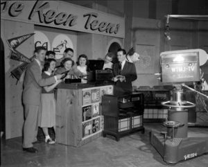 1949 photograph featuring of Milwaukee high school students filming the WTJM-TV program "The Keen Teens," which aired on Saturday afternoons. 