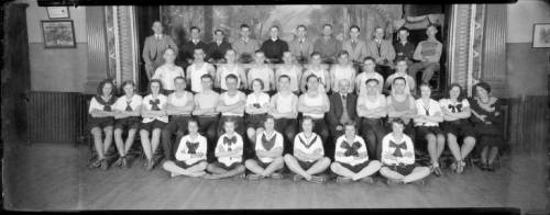 Photograph of a group of young men and women part of a Sokols gymnastics group, taken in 1931.