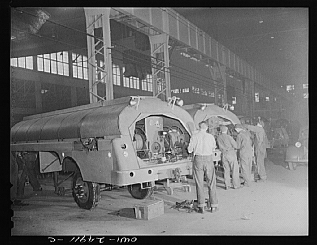 1943 photograph of Heil Company war production employees making gasoline tanker trucks.