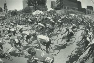 A large crowd watches as people participate in the Bastille Days bike race in 1983.