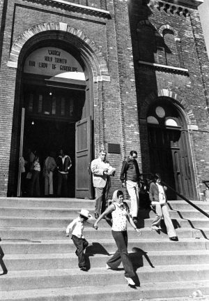 A group of parishioners exit Our Lady of Guadalupe after mass in 1975. 