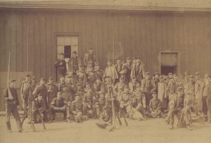 A group of armed militia men called to oppose the 1886 workers' strike pose for a photograph. 