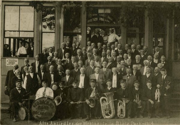 Photograph of a German community band and orchestra in Blatz Park in 1914. 